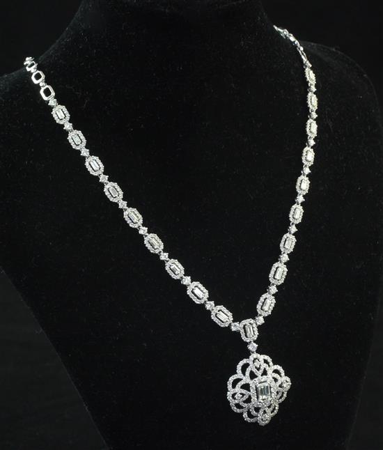 An 18ct white gold and diamond pendant necklace, 18in.